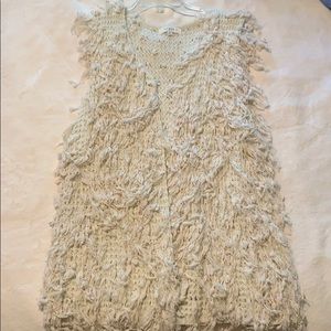 Sleeveless light creamy cardigan with tassels